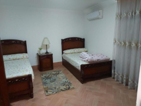Ground floor villa with private garden, parking and shared swimming pool
